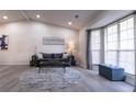 Inviting living room showcasing modern furnishings, a vaulted ceiling, and abundant light from large windows at 2125 Jessica Way, Lithonia, GA 30058