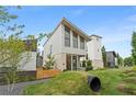 Stylish modern home with eye-catching architecture, bright exterior, and a landscaped front yard at 370 2Nd St, Fayetteville, GA 30214