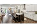 Open-concept kitchen with hardwood floors, a large island, and a view into the living area at 4355 Parkside Pl, Sandy Springs, GA 30342