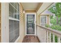 Charming porch with wood floors and views, creating a welcoming entrance to this home at 2304 Country Park Se Dr, Smyrna, GA 30080