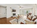 Spacious living room showcasing hardwood floors, fireplace, and large windows at 2304 Country Park Se Dr, Smyrna, GA 30080