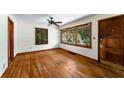 Inviting living room with gleaming hardwood floors, large windows providing natural light, and fresh, neutral paint at 511 Oakview Rd, Decatur, GA 30030