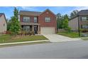 Charming two-story brick home with well-maintained landscaping and a two-car garage at 3062 Hawthorn Farm Blvd, Loganville, GA 30052