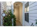 Inviting front porch featuring decorative plants, updated address numbers, and a cozy entrance to the home at 1640 Donovans Nw Rdg, Kennesaw, GA 30152