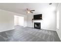 Spacious living room featuring fireplace, new carpet, ceiling fan and abundant natural light at 2837 Lakewater Way, Snellville, GA 30039