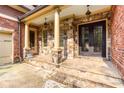 Covered front porch with stone columns and detailed stonework at 3333 N Hembree Rd, Marietta, GA 30062
