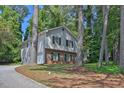 Two story home featuring a brick facade and light gray siding on a well landscaped lot at 752 Roxboro Trce, Lawrenceville, GA 30044