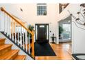 Inviting foyer with hardwood floors, staircase, and high ceilings at 1045 Paper Creek Dr, Lawrenceville, GA 30046