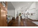 Open-concept living space with hardwood floors leading to a bright, modern kitchen at 1790 Shirley Sw St, Atlanta, GA 30310