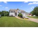 Two-story home with a manicured lawn, stone accents, a driveway, and an attached two-car garage at 758 Beranda Cir, Douglasville, GA 30134