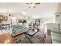 Bright living room featuring hardwood floors, neutral walls, a ceiling fan, and an open floor plan at 758 Beranda Cir, Douglasville, GA 30134
