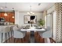 Elegant dining room features a marble table, stylish chairs, and access to the outdoor area at 1199 Lavista Ne Rd, Atlanta, GA 30324