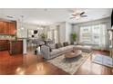 Open-concept living room with hardwood floors, modern furniture, and a cozy fireplace at 1199 Lavista Ne Rd, Atlanta, GA 30324