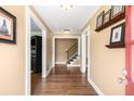 Inviting foyer showcasing hardwood floors, fresh paint, elegant trim, and a staircase at 6596 Wright Ne Rd, Atlanta, GA 30328