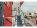 Open foyer featuring a staircase, high ceilings, and access to the living areas at 9760 Loblolly Ln, Roswell, GA 30075