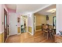 Open foyer with hardwood floors, dining room, and decorative wallpaper at 3299 Pete Shaw Rd, Marietta, GA 30066