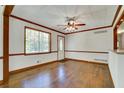 Inviting living room with hardwood floors, natural light, and fresh paint at 606 Evergreen Dr, Woodstock, GA 30188