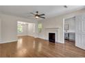 Spacious living room featuring hardwood floors, a fireplace, and an open layout at 2115 Pinehurst Dr, East Point, GA 30344