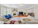 Bright living room featuring hardwood floors, fireplace, and lots of natural light at 2565 Holcomb Springs Dr, Alpharetta, GA 30022