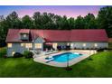 Backyard features an in-ground pool, deck, and well-maintained lawn at 425 Chadwick Pl, Canton, GA 30114