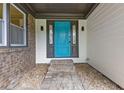 Close-up of front door with sidelights and brick pathway at 679 Creek View Dr, Lawrenceville, GA 30044