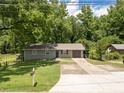 Exterior of single story home with an attached garage and a well-maintained front lawn at 2172 Se Wakita Se Dr, Marietta, GA 30060