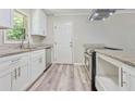 Modern kitchen with stainless steel appliances, white cabinets, and granite countertops at 2172 Se Wakita Se Dr, Marietta, GA 30060