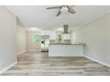 Open-concept kitchen featuring stainless steel appliances, granite countertops, and ample lighting at 2172 Se Wakita Se Dr, Marietta, GA 30060