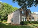 Elegant brick home featuring a bay window and well-maintained landscaping in a desirable neighborhood at 3389 Rosecliff Trce, Buford, GA 30519