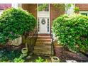 Inviting front porch with brick steps and lush green plants at 2610 Chadwick Rd, Marietta, GA 30066