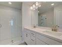 Elegant bathroom with double vanity, white cabinetry, and a glass-enclosed tiled shower at 3338 Cranston Ln, Kennesaw, GA 30144