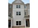 Charming townhome features a blend of brick and siding, creating a modern and inviting facade at 3338 Cranston Ln, Kennesaw, GA 30144