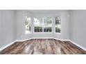 Bright living area boasts large bay windows and hardwood floors, creating a welcoming and airy atmosphere at 4041 Ash Tree St, Snellville, GA 30039