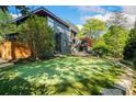 Beautiful home with a putting green and mature trees, blending recreation with natural beauty at 265 Tara Trl, Atlanta, GA 30327