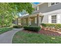 Inviting front entrance with covered porch and brick accents at 3544 Chestatee Dr, Marietta, GA 30062