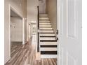 Bright entryway with staircase and wood-look flooring leads to a welcoming interior at 9066 Bob Jackson Dr, Jonesboro, GA 30238
