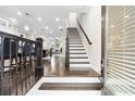 Inviting foyer featuring hardwood floors, staircase, and an open view of the home's interior at 3786 Alstead Manor Way, Suwanee, GA 30024