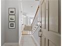 Inviting entryway showcasing staircase, tiled floor, and seamless transition to the living spaces beyond at 850 Piedmont Ne Ave # 3304, Atlanta, GA 30308