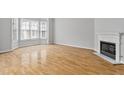Living room with hardwood floors, a fireplace, and a bay window at 850 Piedmont Ne Ave # 3304, Atlanta, GA 30308