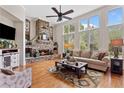 Inviting living room with a stone fireplace, hardwood floors, and plenty of natural light at 388 Golf Crest Dr, Acworth, GA 30101