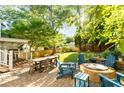 Inviting outdoor space with patio seating, a fire pit, and a lush green lawn perfect for entertaining at 891 Paoli Se Ave, Atlanta, GA 30316