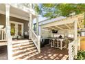 Spacious outdoor kitchen and entertaining area with a built-in grill and bar seating at 891 Paoli Se Ave, Atlanta, GA 30316