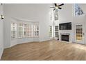 Bright and airy living room with a fireplace, and large windows at 4044 Spring Cove Dr, Duluth, GA 30097