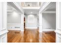 Elegant foyer with gleaming hardwood floors and classic white trim at 740 Creek Wind Ct, Duluth, GA 30097