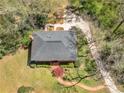 An aerial view showcases the home's roof, landscaping, driveway, and surrounding greenery at 2270 Emerald Dr, Jonesboro, GA 30236