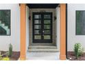 Close-up of a modern front door with stone accents and minimalist design at 1604 Niskey Lake Rd, Atlanta, GA 30331
