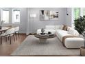 Bright living room with modern decor, a large sectional sofa, and stylish furnishings provides a comfortable gathering space at 1604 Niskey Lake Rd, Atlanta, GA 30331