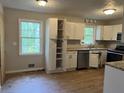 Functional kitchen with neutral cabinets and stainless steel appliances, ready for updates at 1978 Winding Creek Sw Ln, Marietta, GA 30064