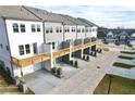 Townhome featuring individual decks, private garages, and modern AC units for each unit at 741 Cordele Ln, Sugar Hill, GA 30518