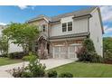 Beautiful two-story home with brick accents, a two-car garage, and a well-maintained front yard at 935 Grove Valley Drive Dr, Cumming, GA 30041
